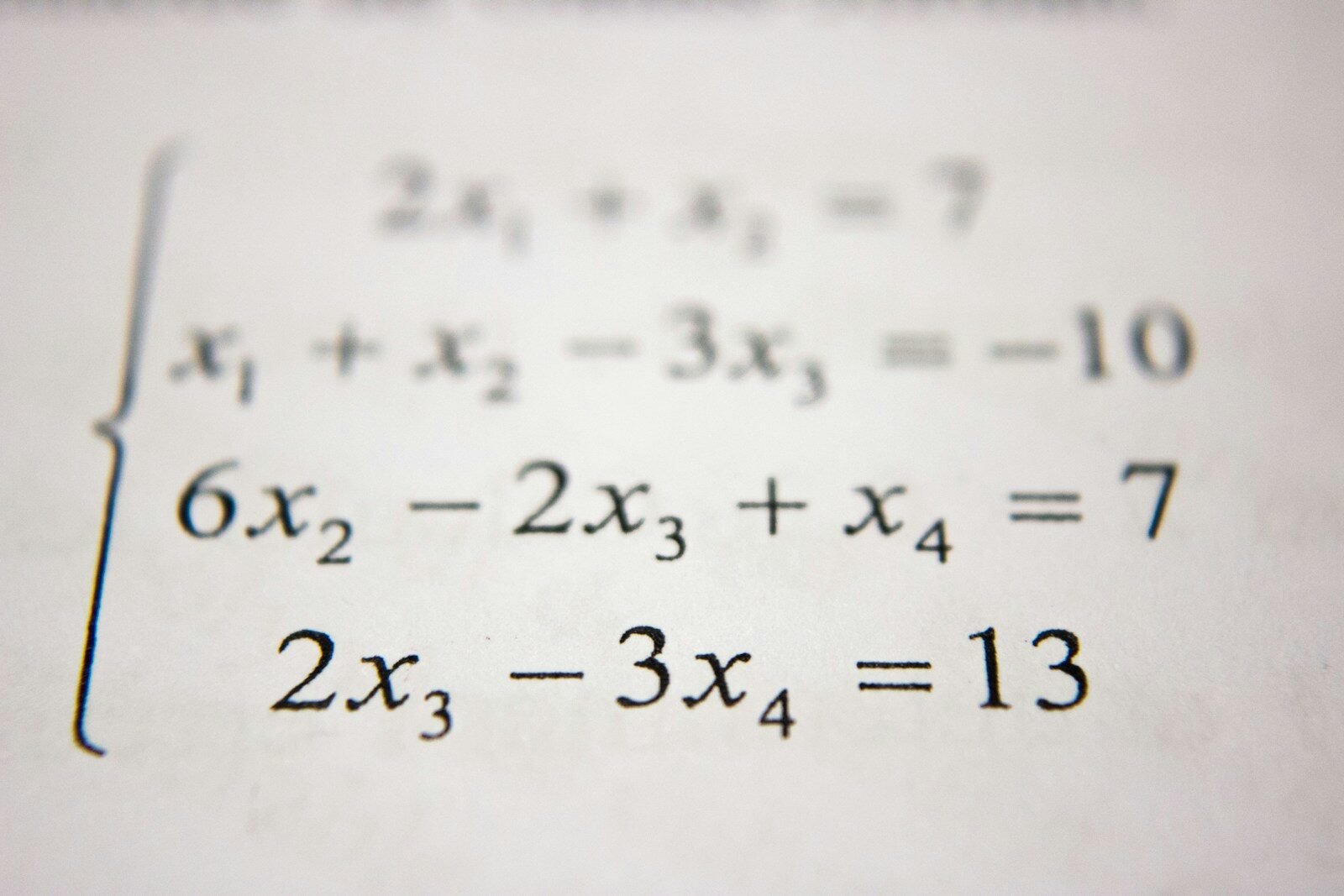 A system of linear equations printed in black ink on white paper